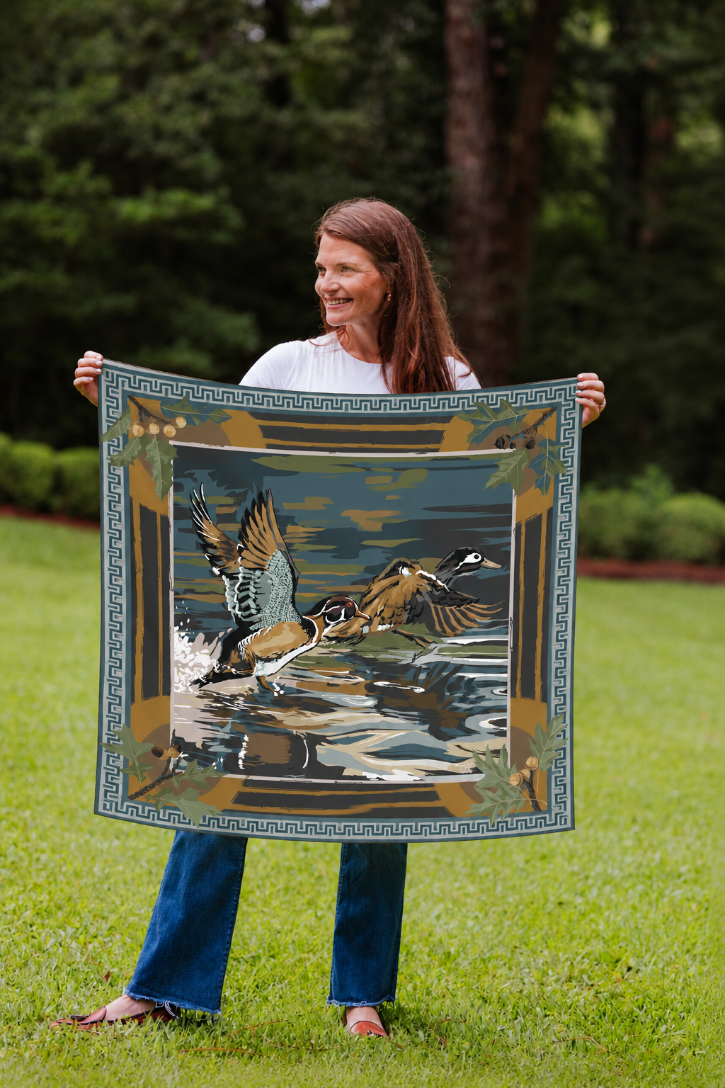Model holding the Marsh Dusk Landing wood duck silk scarf
