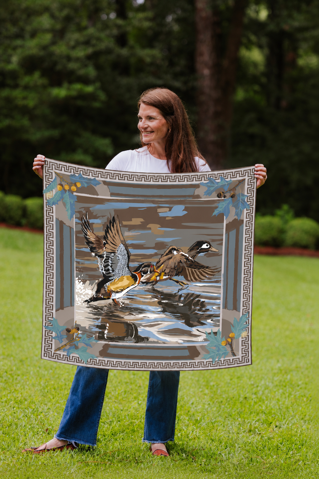 Model holding the Mist Dusk Landing wood duck silk scarf